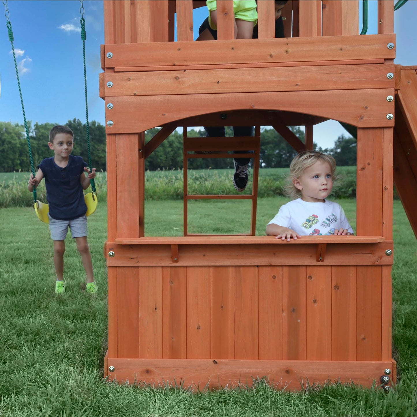 Backyard Discovery Atlantis Cedar Wood Swing Set with Wave Slide, Raised Clubhouse, Rock Wall, Belt Swings, Trapeze, Balcony, Lower Play Space, Snack Bar, Sandbox Area, Step Ladder, Outdoor Playset