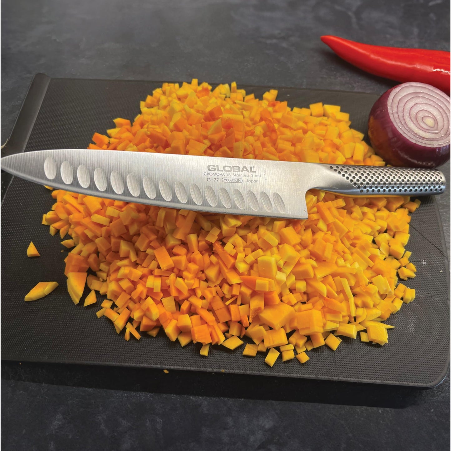 Global 8 inch Hollow Ground Chef's Knife - Lightweight Japanese Stainless Steel, Razor-Sharp Edge, Made in Japan, G-77