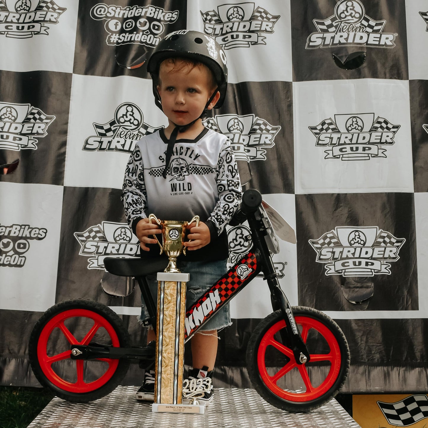 Strider 12” Sport Bike, Black - No Pedal Balance Bicycle for Kids 1 to 4 Years - Includes Safety Pad, Padded Seat, Mini Grips & Flat-Free Tires - Tool-Free Assembly & Adjustments